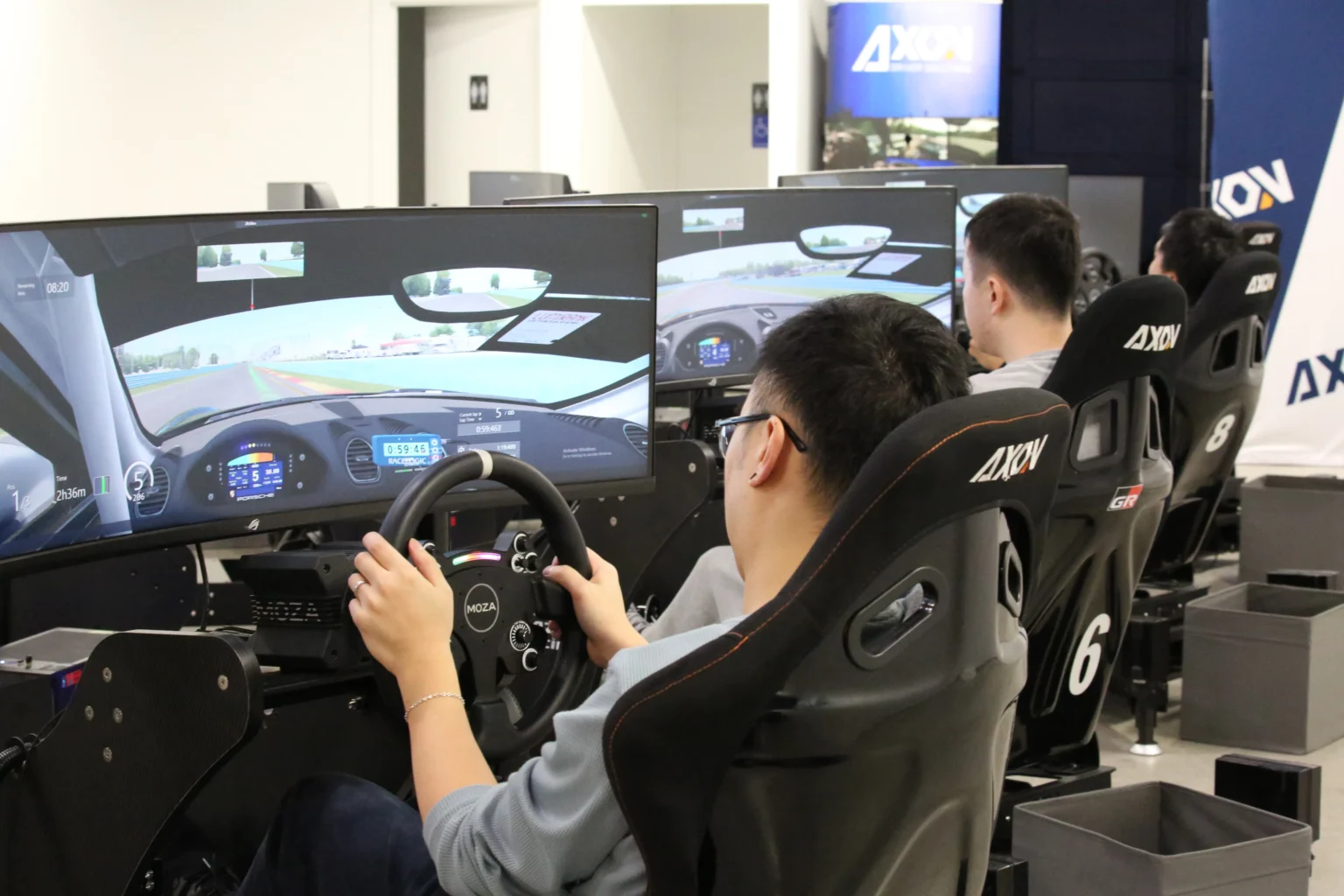 A driver at the wheel of an Axon simulator inside the Richmond sim centre